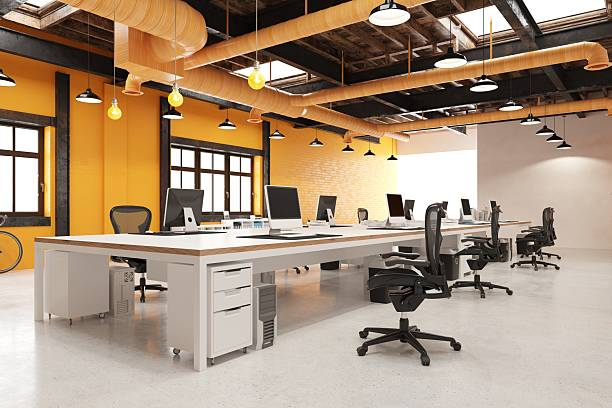 Office interior with warm yellow paint and smooth wall finishes by a painter in Oxford, PA.