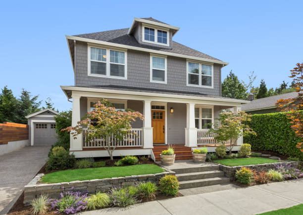 Home with gray exterior paint and crisp white trim by an exterior painter in Kennett Square, PA.
