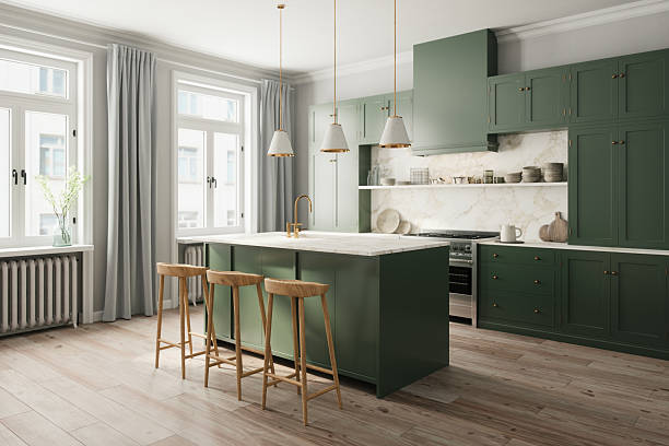 Kitchen with sage green cabinets, a satin finish, and crisp white trim by an interior painter in Chadds Ford, PA